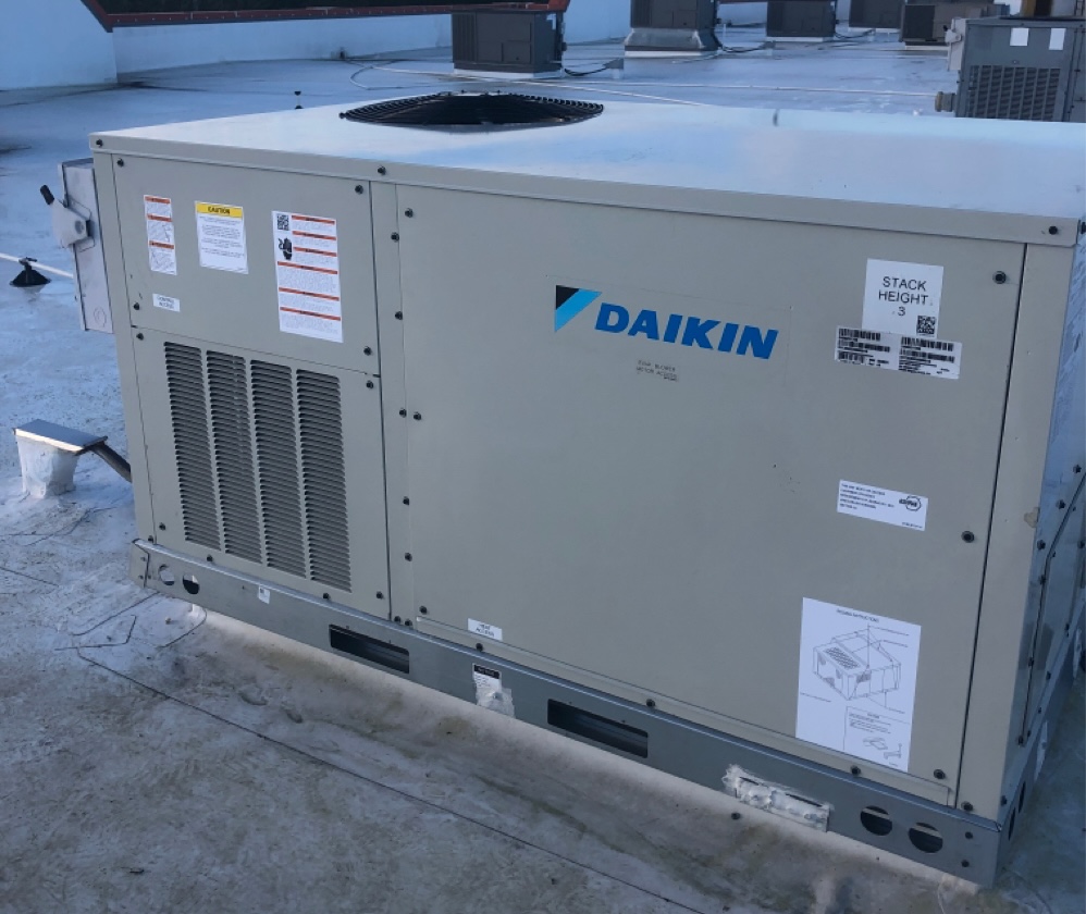HVAC technician repairing residential air conditioning unit in Central Florida